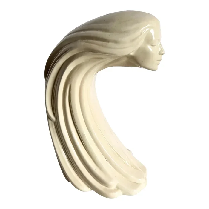 “Woman of the Wind” or “Moderne Frauenbüste Mit Langem Haar Aus Steinguss” From Ceramic